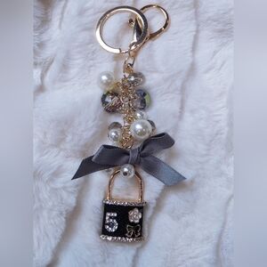 Elegant Black and Gold Keychain with Pearls